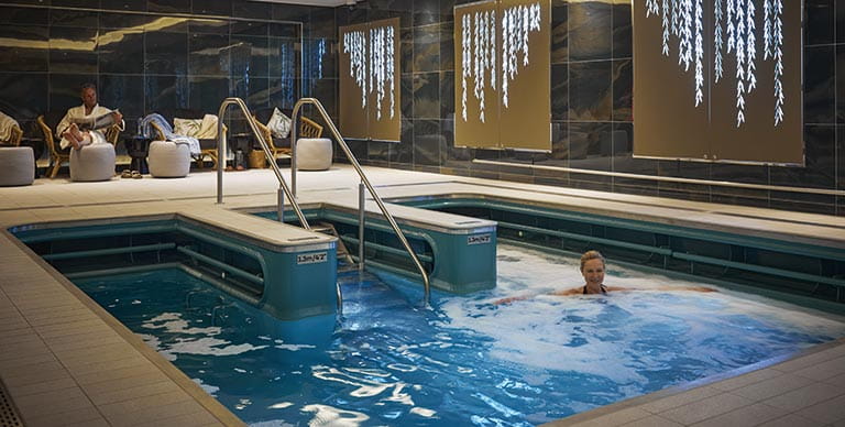 A woman enjoying a dip in the hydrotherapy pool